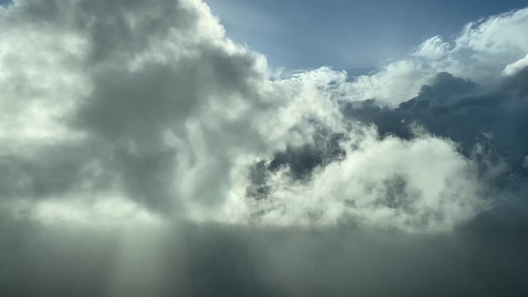 flying through the clouds in daylight