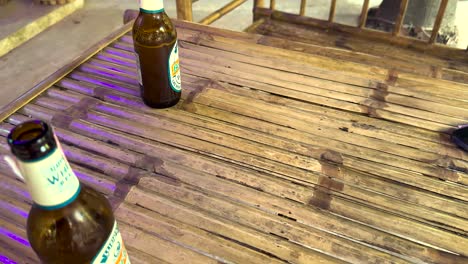 pizza and beer on a bamboo table