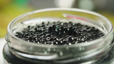 black caviar in a glass jar