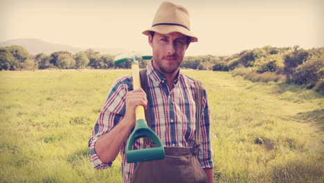 happy farmer holding a shovel