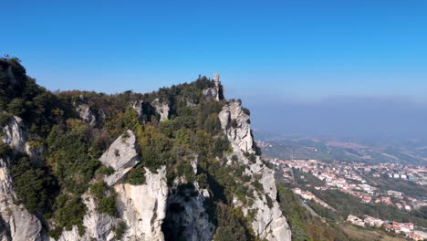 stunning aerial capture of guaita castle under clear blue skies in san marino.