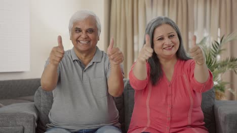 Cheerful-Indian-old-couple-showing-thumbs-up