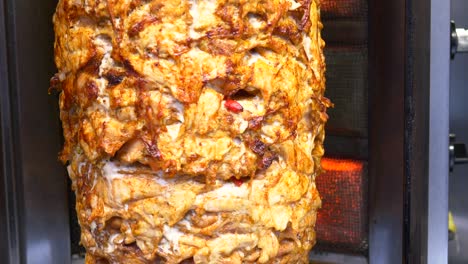 close up of a delicious doner kebab rotating on a spit