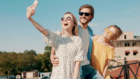 friends taking a selfie on a rooftop