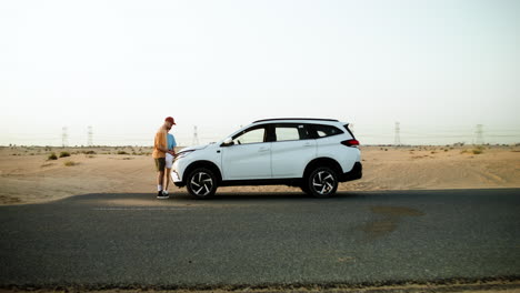 broken down car in the desert