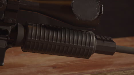 dolly of ar-15 handguard underneath a sniper scope