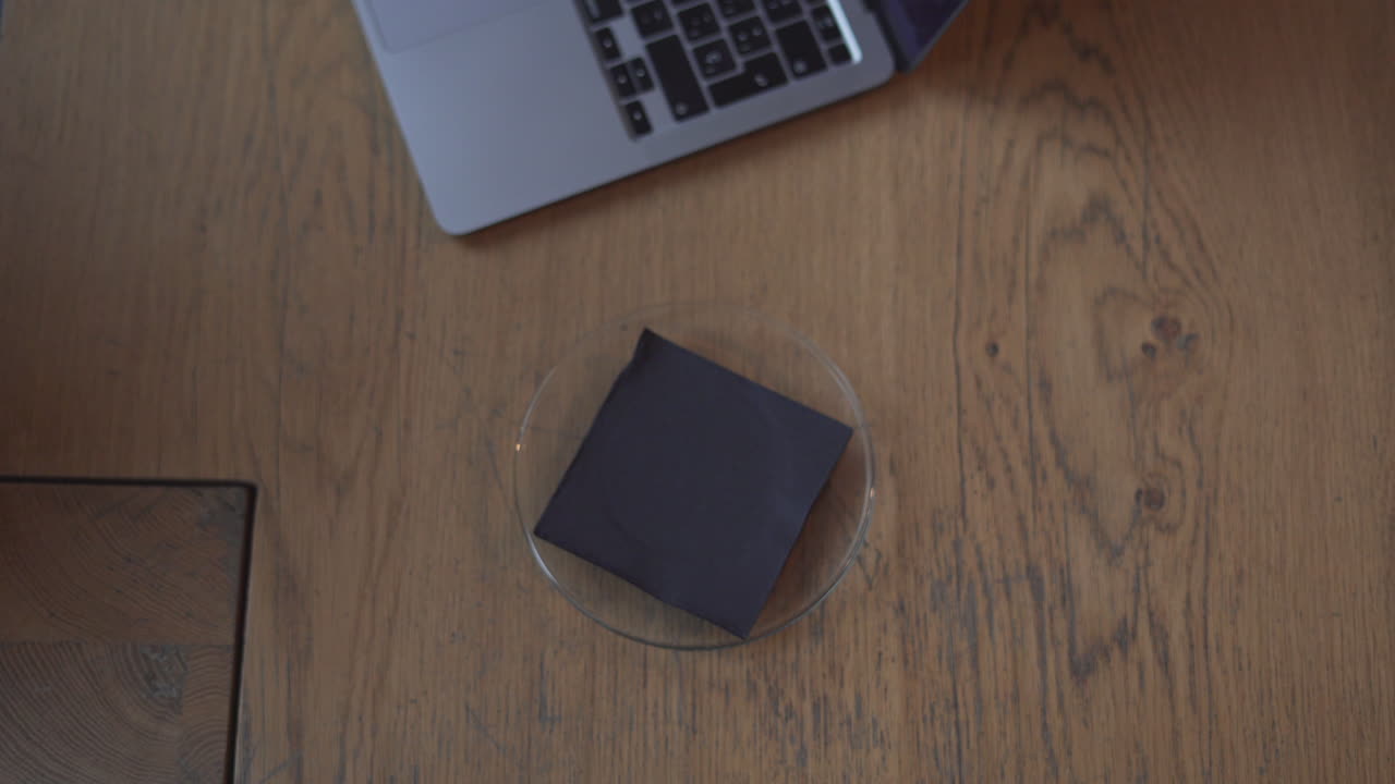 Woman working at a cafe with coffee and laptop