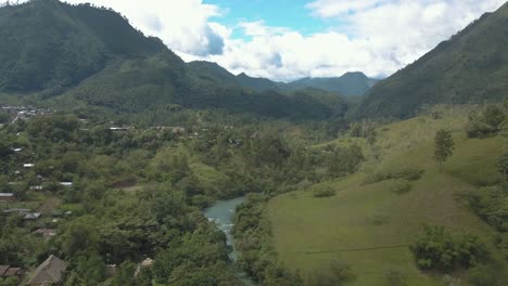 drone aerial rising shot, landscape view of the tropical valley, mountains and river cahabon in guatemala