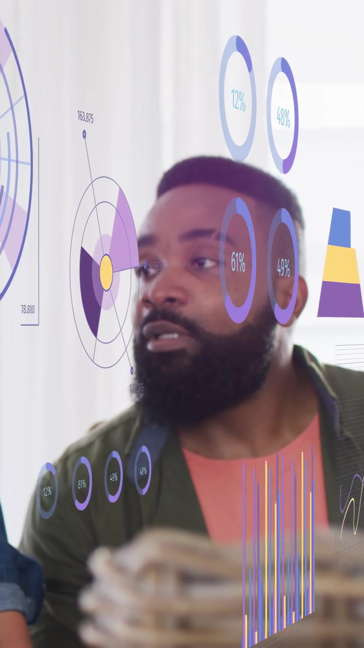 Vertical video: Woman leaning on tablet starting AR charts, man analyzing rings, bars for analytics
