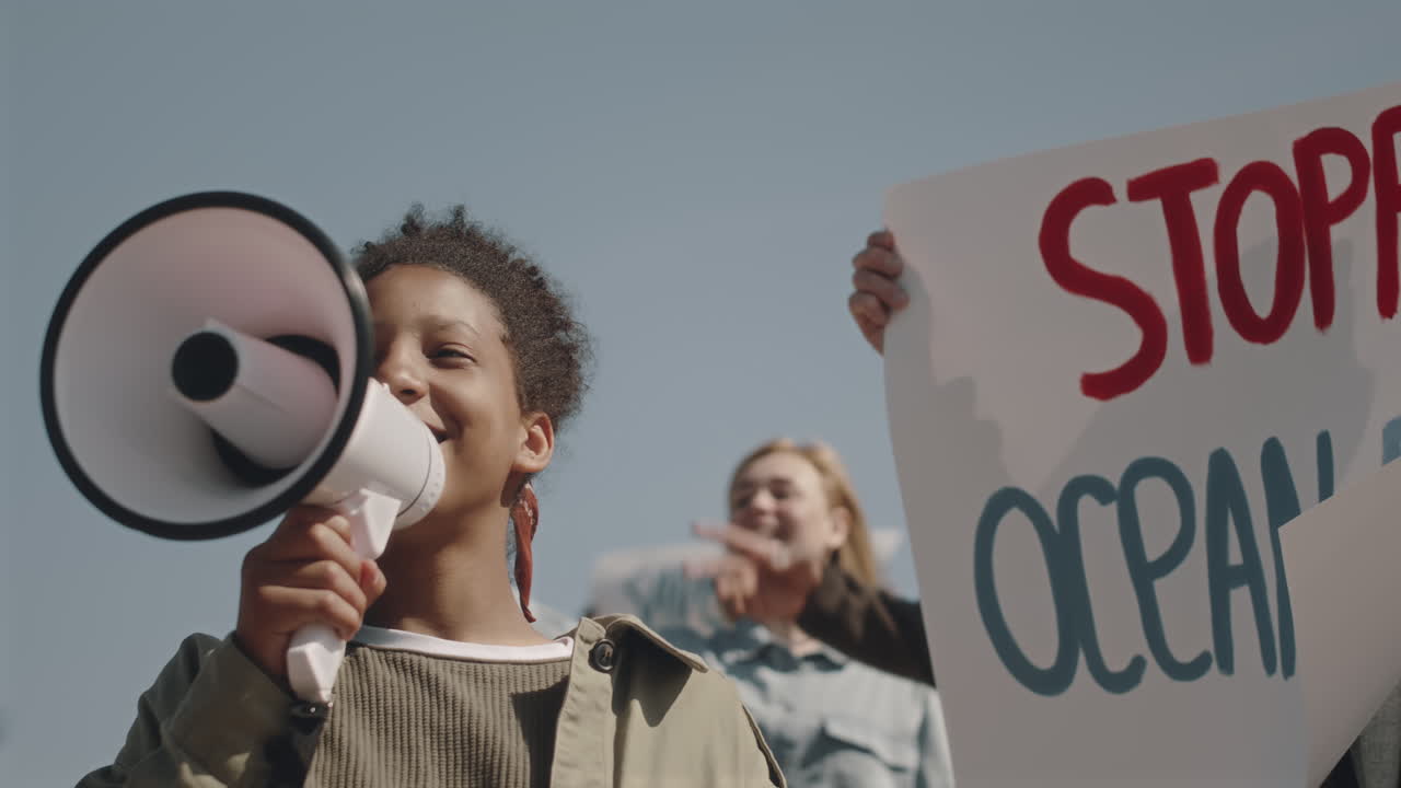 Environmental Activist Talking with Megaphone on Protest