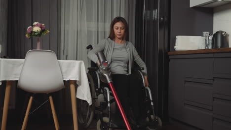 woman with muscular weakness cleans using vacuum cleaner