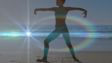 animación de puntos de luz sobre mujer caucásica practicando yoga en la playa.