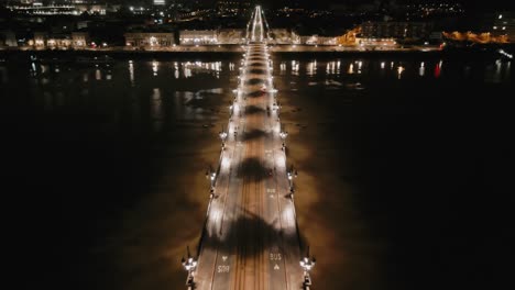 puente iluminado de pierre, río garona, bordeaux - paso aéreo
