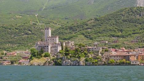 establishing shot scaliger castle malcesine from lake garda boat cruise