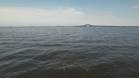 A-low-angle-view-of-the-Great-South-Bay-Bridge-in-the-distance-on-a-sunny-day