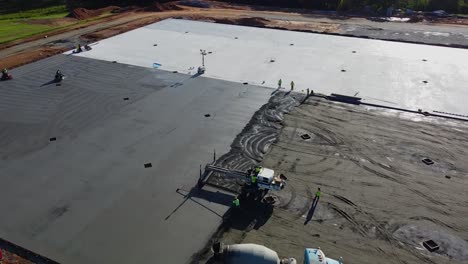 an orbit around a construction site with a heavy duty machine screed and trowels