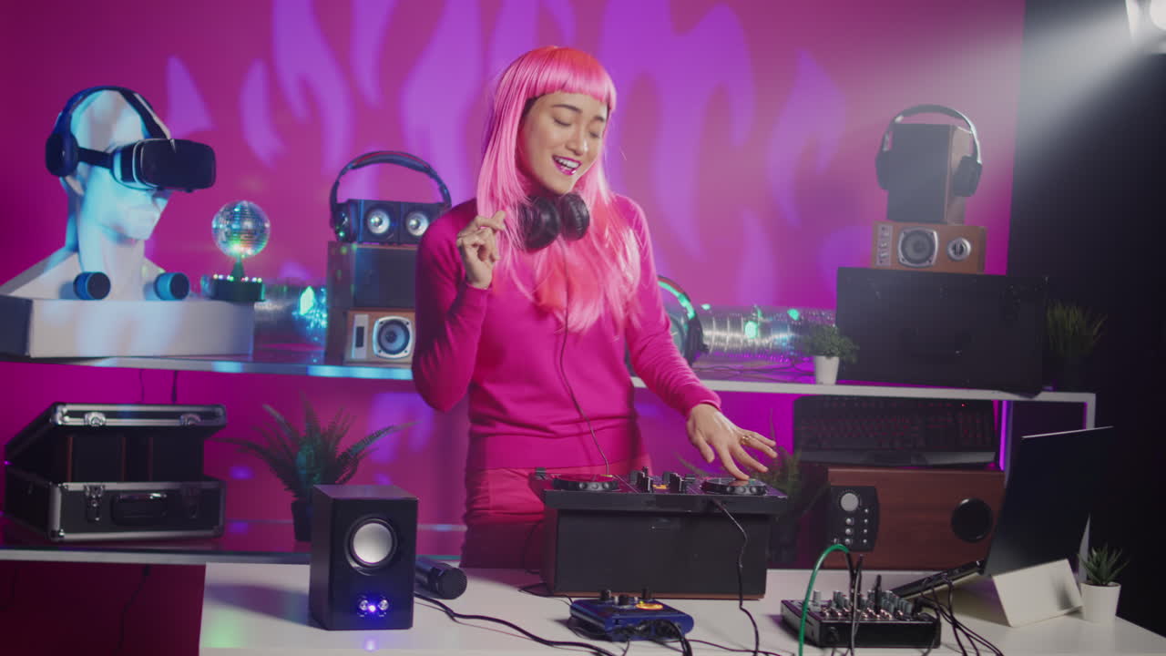 Woman with Pink Hair DJing in Studio