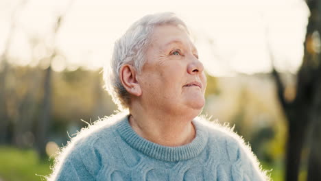 Senior-woman,-thinking-and-relax-outdoor-in-a-park