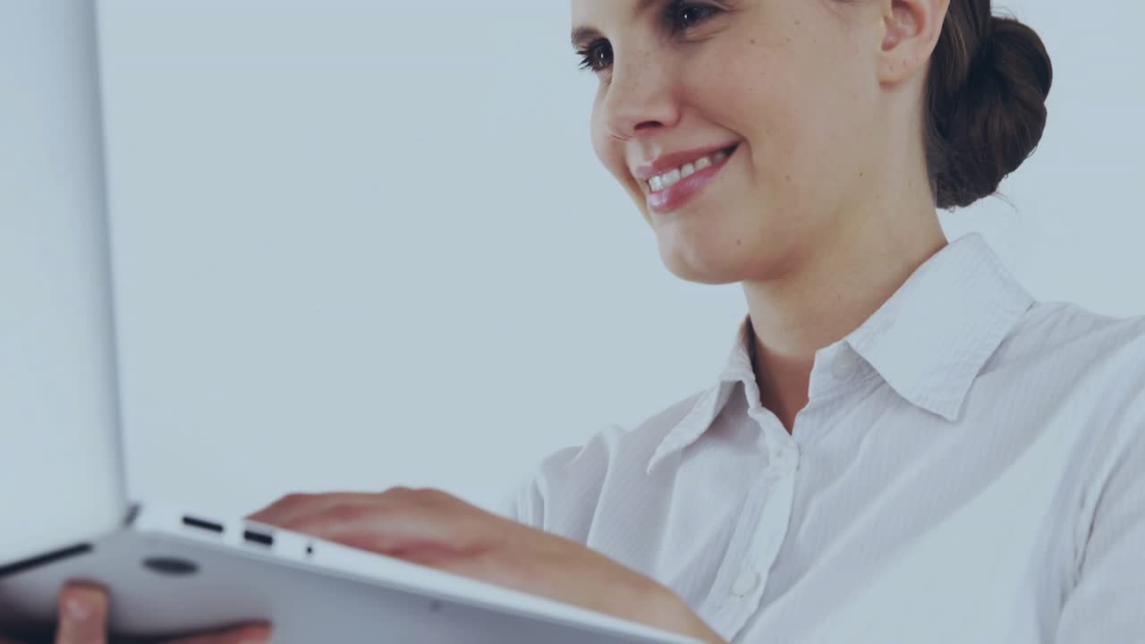 Businesswoman typing on laptop and initiating glitching world map overlay for business insight