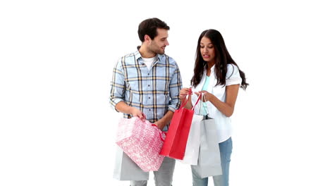 attractive young couple holding shopping bags