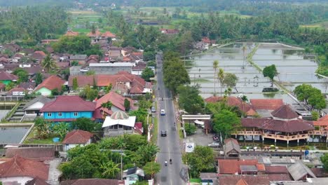 Forward-aerial-along-road-through-village-of-Mungkid-in-Indonesia