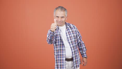 Man-making-positive-gesture-at-camera.