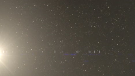 검은 바탕에  점 위에 렌즈 플레어의 애니메이션