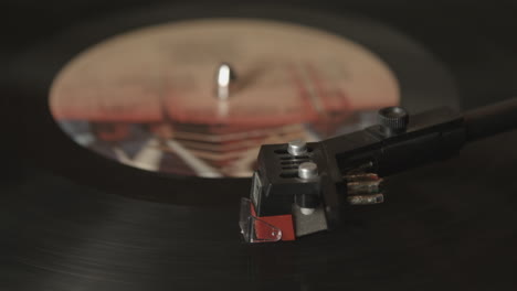 overhead footage of a vintage record player playing an lp record