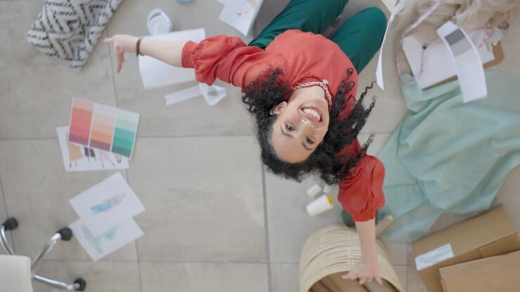 Top view, fashion designer and woman on floor