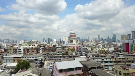 bangkok city skyline, sunny day with clouds, urban and lively mood