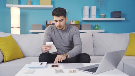 Confused-young-man-looking-at-overpriced-bill.