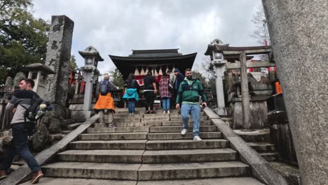 group of people ascending and descending shrine stairs