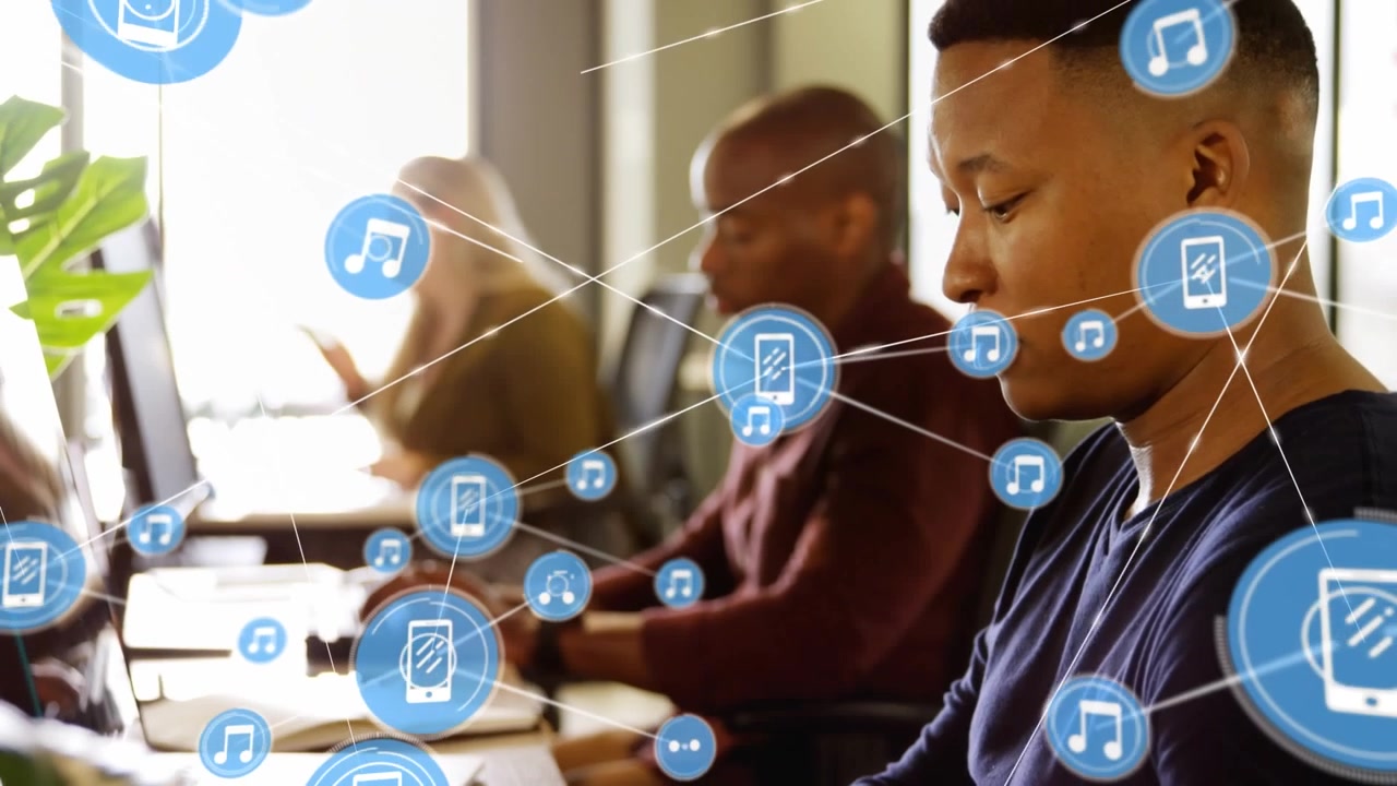 Animation of network of connections with icons over diverse business people in office
