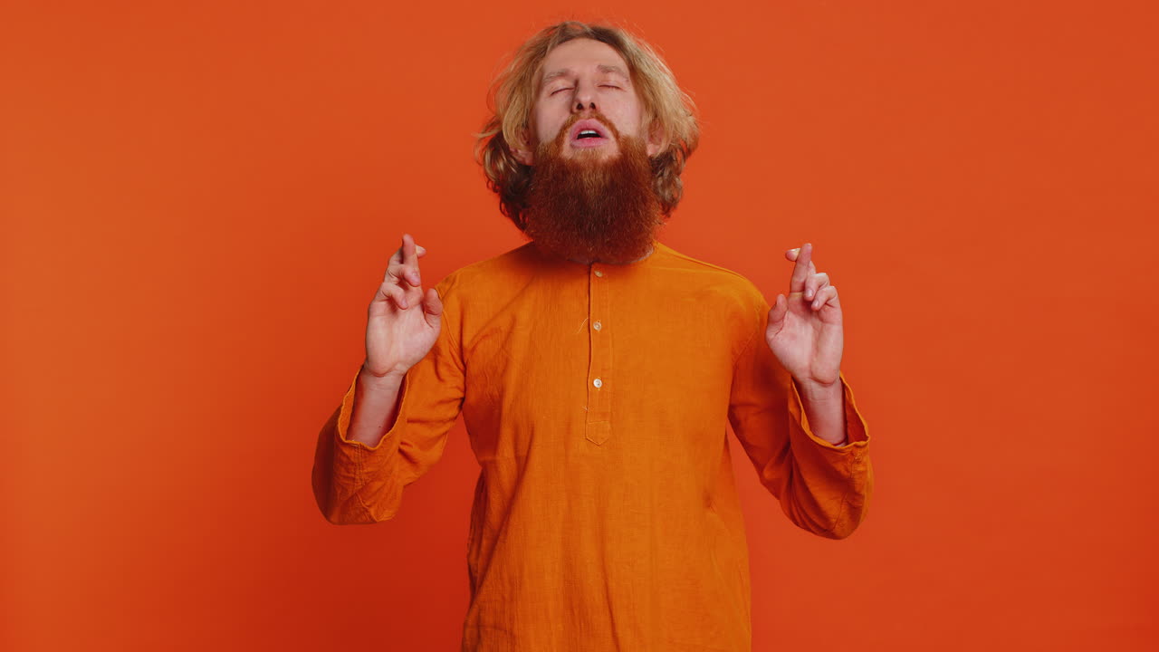 Caucasian man meditating breathes deeply with mudra yoga gesture eyes closed taking a break relax