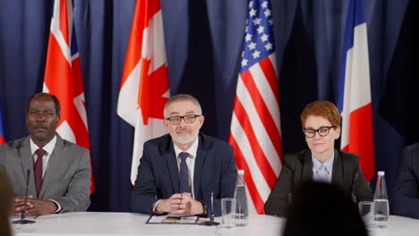 political leaders giving speech at press conference