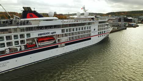 aerial side view moving stern to bow of cruise vessel hanseatic spirit while alongside at port of turku. this was the first cruise vessel to arrive since covid-19 suspended all cruises.