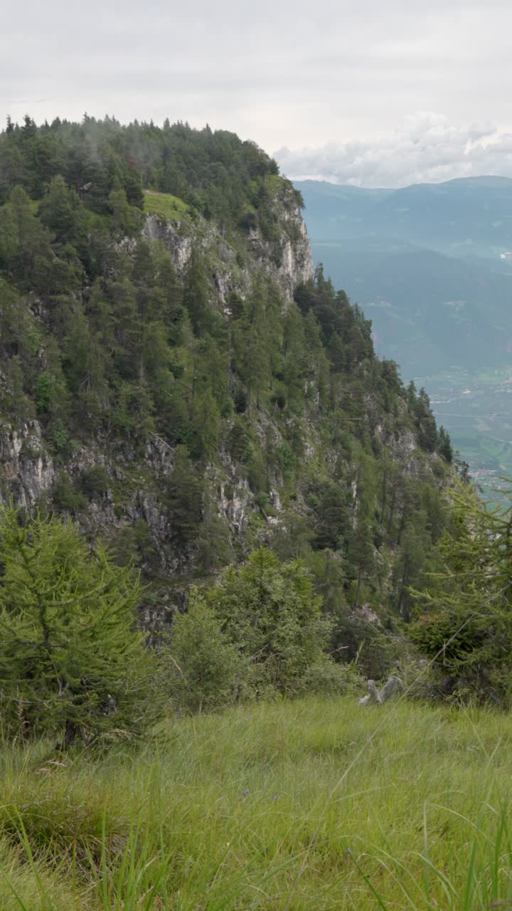 View of Little Mount Penegal near Mendel Pass, Trentino, Italy on a cloudy and overcast day