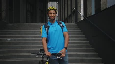 smiling delivery person with bicycle