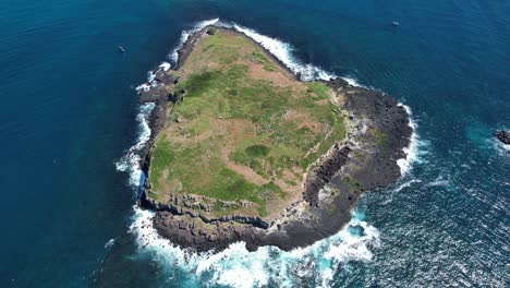 aerial shot over cook island (joong-urra-narrian) in nsw, australia