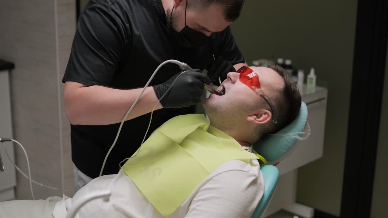 Dentist Performing Dental Procedure on Patient
