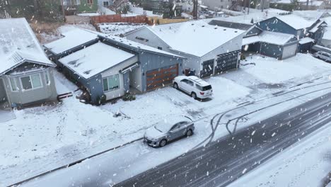 Aerial-of-snowed-in-modern-homes-during-a-cold-winter-snowfall