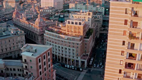 aerial view at sunset over historic piazza dante with street activity, genoa