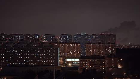 timelapse of window lights and smoking pipes in city at night moscow russia