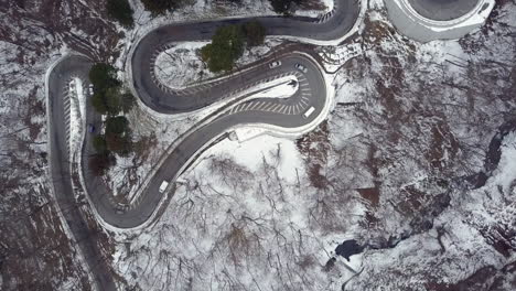 aerial god view of traffic traveling along the winding irohazaka mountain highway, nikko, tochigi, japan