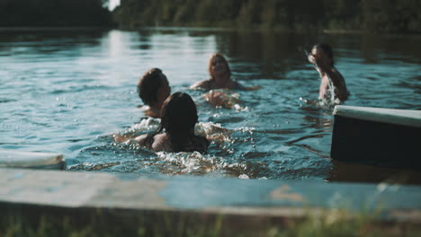friends swimming in a lake