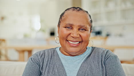 portrait of senior black woman with smile in home