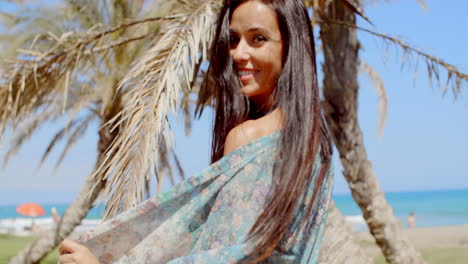 Carefree-Woman-at-the-Beach-Looking-at-Camera