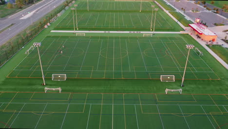 aerial riser view over sports grounds with soccer fields next to each other