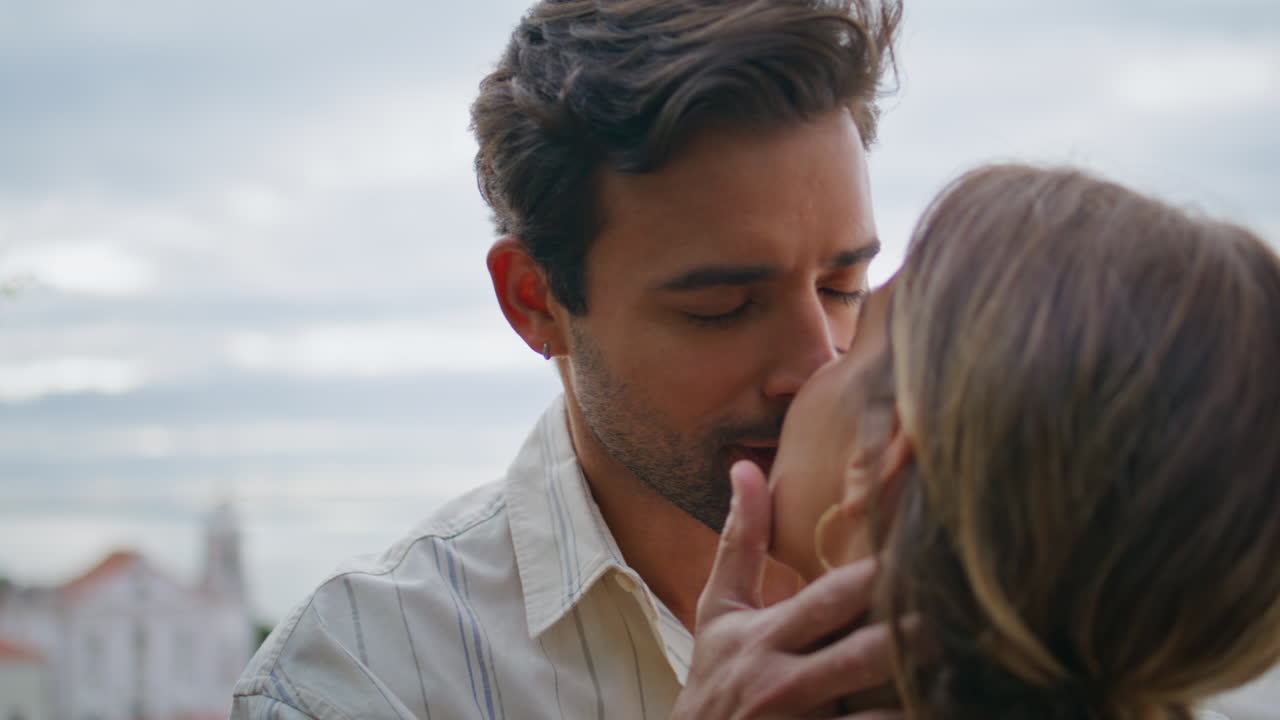 Closeup happy couple romantic date at cityscape terrace. Man looking girlfriend