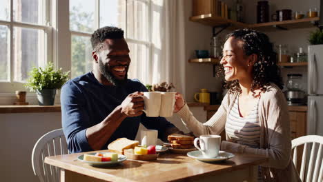 couple enjoying breakfast at home